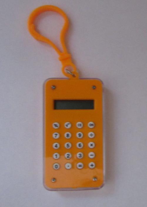 Oranžová kalkulačka s hlavolamem - přívěsek na klíče